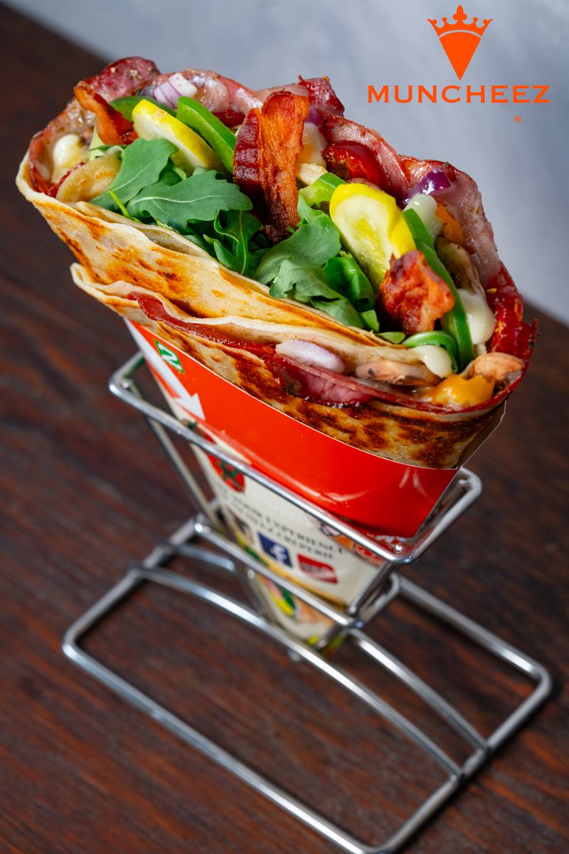 The surprise of the day: a loaded savoury crepe in a Muncheez stand on a wooden counter