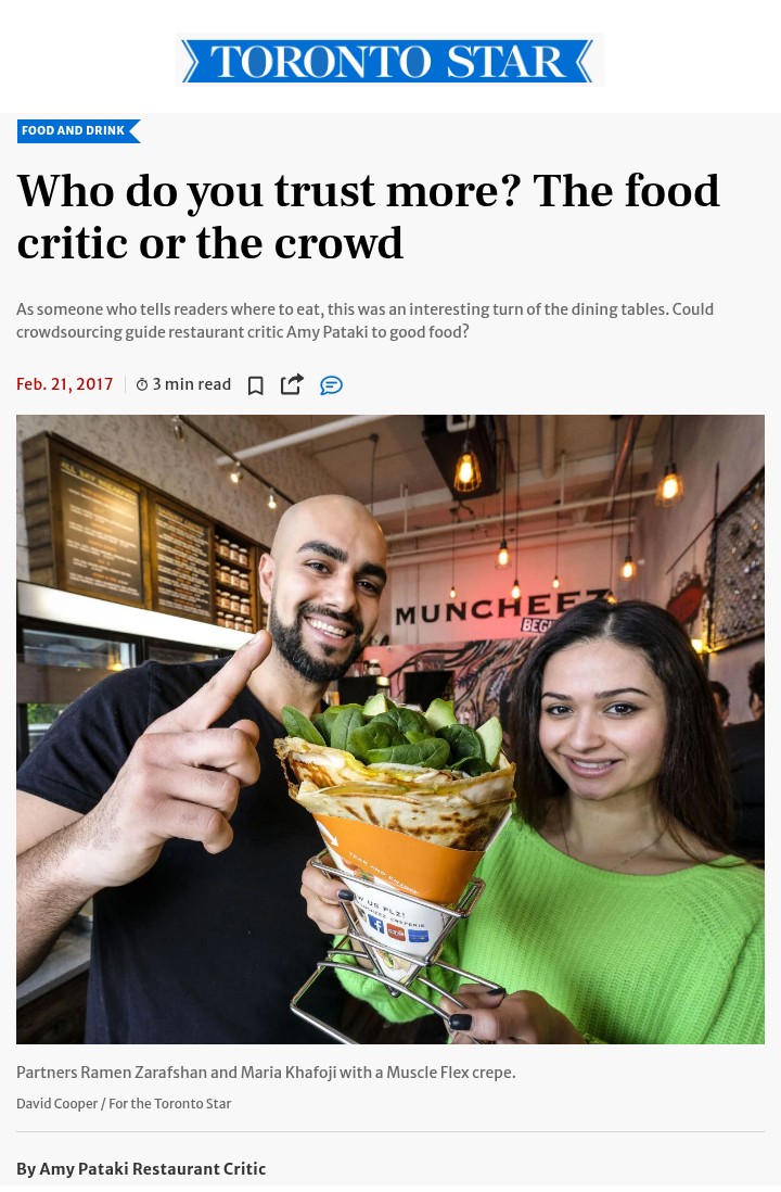 Toronto Star article headlined: Who do you trust more? The food critic or the crowd. Below it, the Muncheez partners hold a Muscle Flex crepe in front of the shop's mural. Photo by David Cooper.